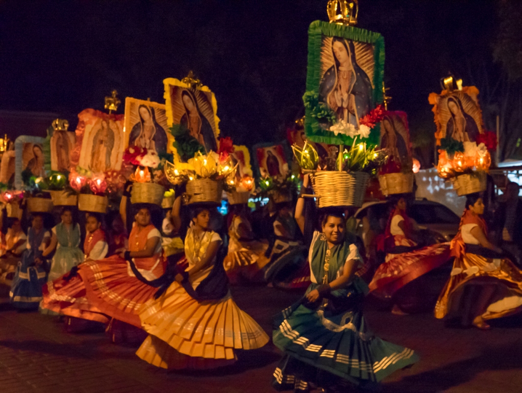 Dancers with images of the Virgin of Guadalupe